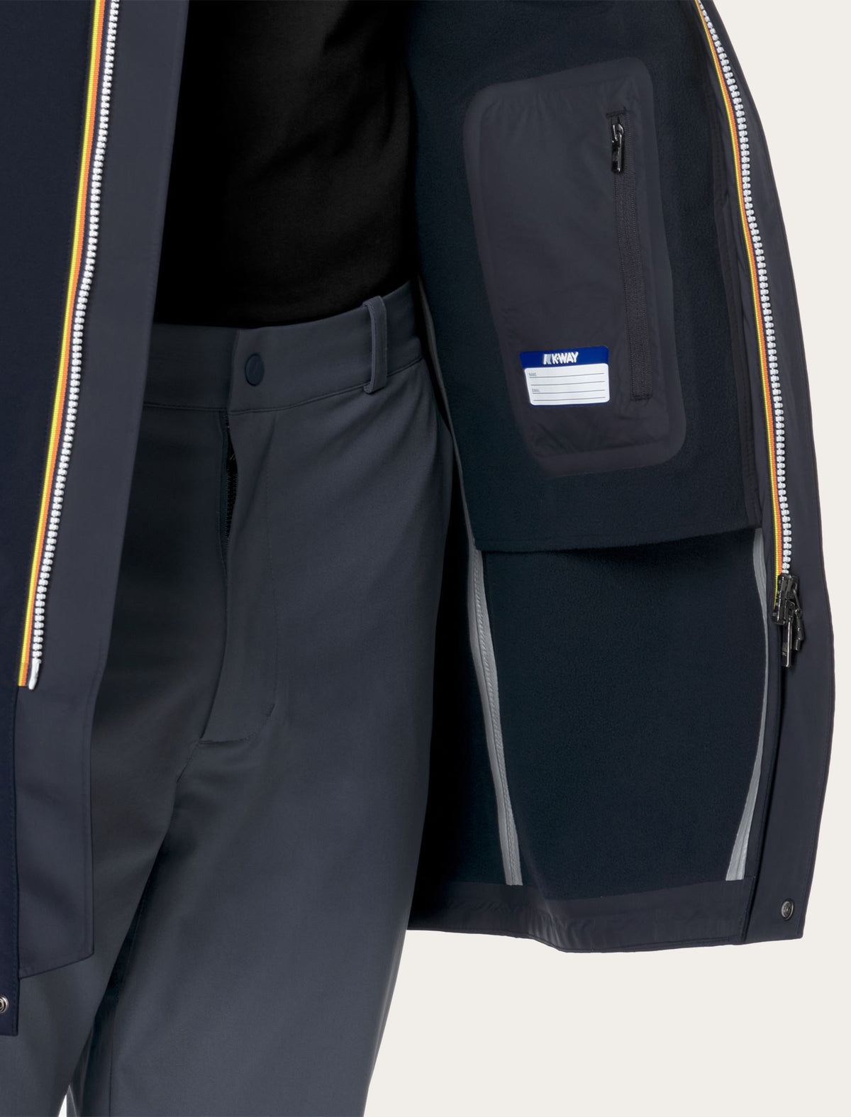 K-Way Thomas Bonded — détail intérieur poche zippée, doublure polaire et zip tricolore signature